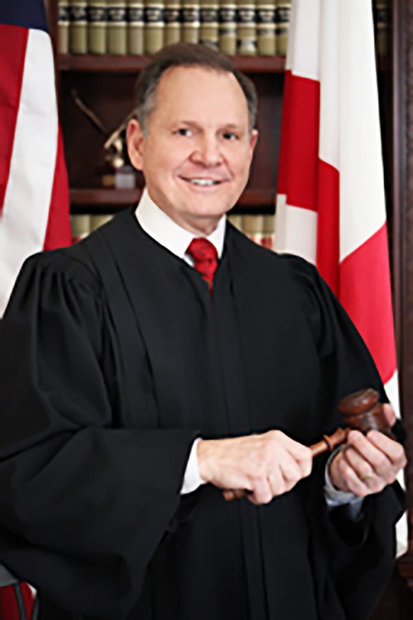 Chief Justice Moore suspended without pay