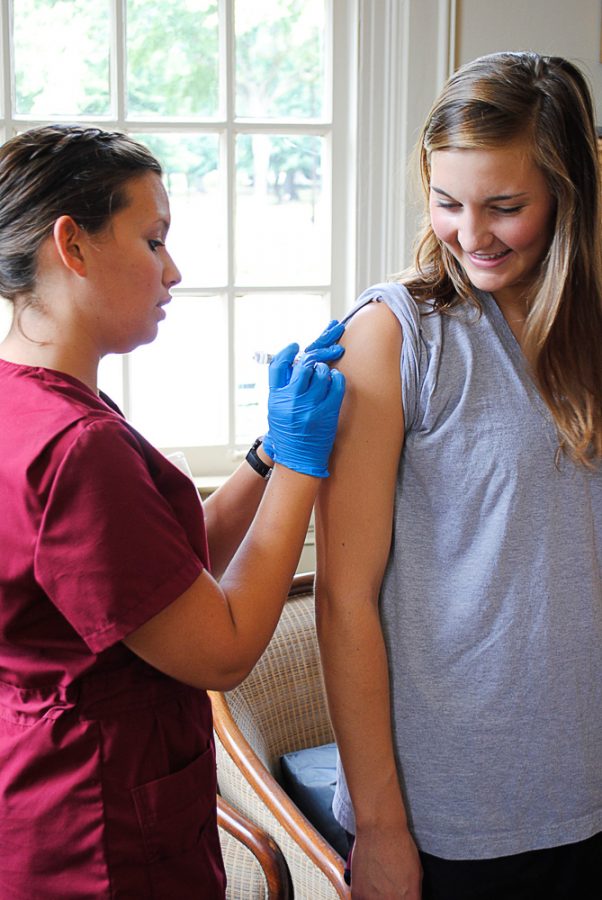 The Capstone College of Nursing also provides free flu shots to students. Junior nursing student Mollie Wallace administers a flu shot to sophomore Jessica Bell Tuesday afternoon in Daster Hall. 