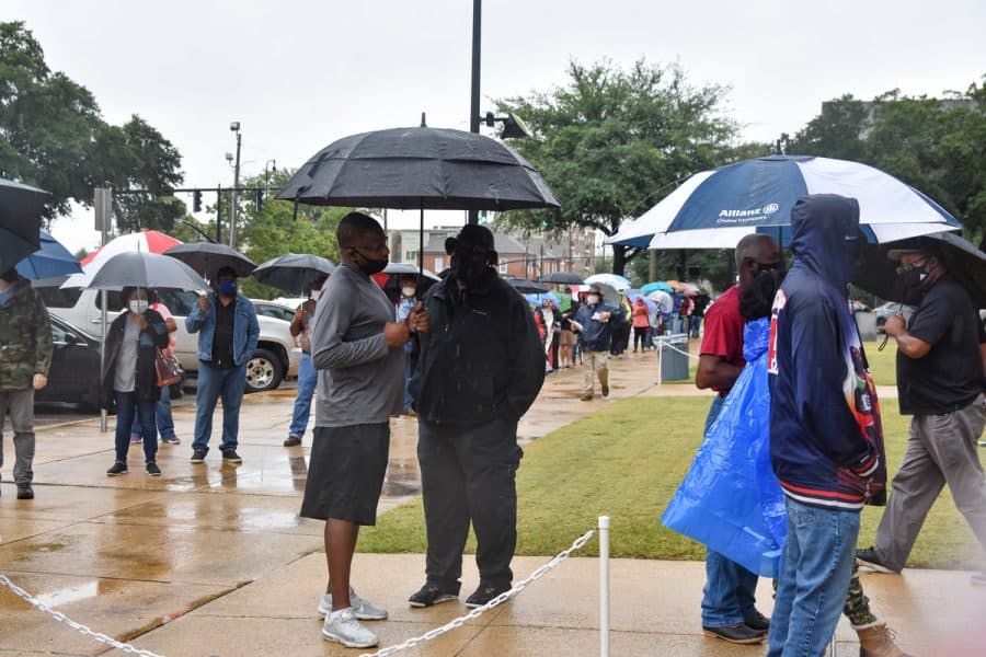 Voting absentee in-person was a popular option for registered voters in Alabama this year, sometimes resulting in long, rainy lines.