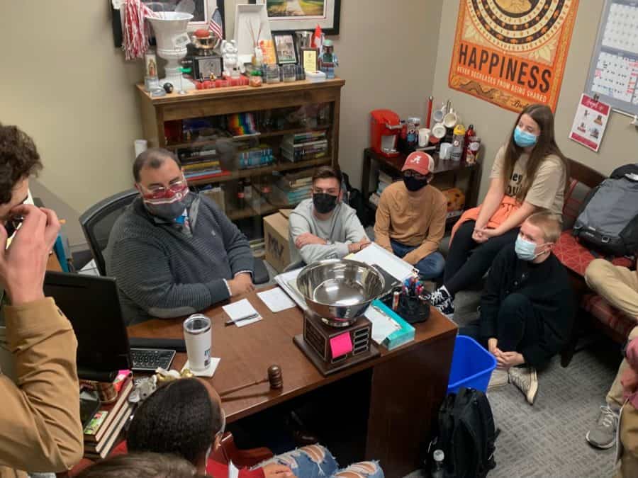 SGA Adviser Angel Narvaez-Lugo invites students into his office on Monday, Nov. 1, during a sit-in to protest the results of the homecoming queen election. 