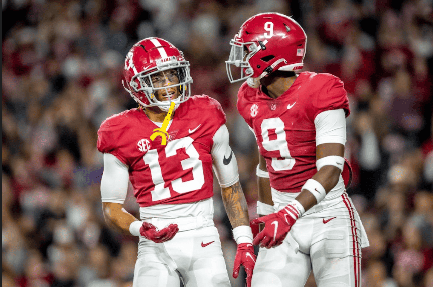 Malachi Moore and Jordan Battle strategize during the game against LSU on Saturday.
