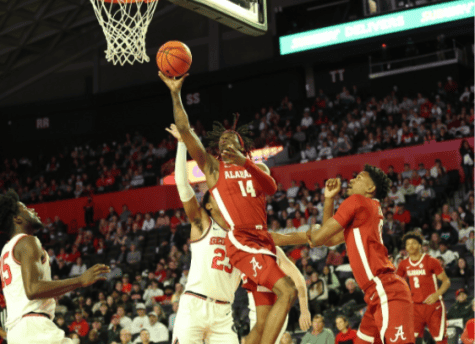 Alabama guard Keon Ellis (14) makes a play at the rim in the Crimson Tide’s 82-76 loss to Georgia on Tuesday night at Stegeman Coliseum in Athens, GA. 