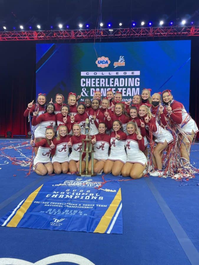  Alabama cheer poses with the trophy following the UCA D1A all-girl competition Sunday afternoon. 