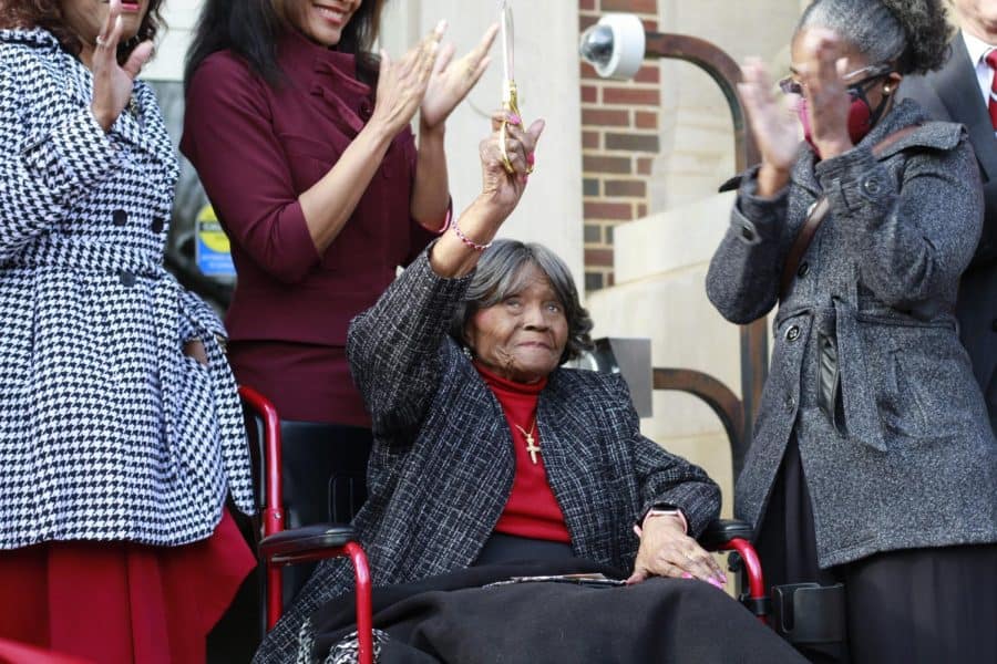 Autherine Lucy waves to the crowd after cutting the ribbon at the dedication of the newly named Autherine Lucy Hall in Tuscaloosa, Alabama on Feb. 25, 2022.