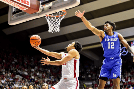 Alabama forward James Rojas (33) drives past Kentucky forward Keion Brooks Jr. (12) for the layup in the Crimson Tide’s 66-55 loss on Feb. 5, 2022.