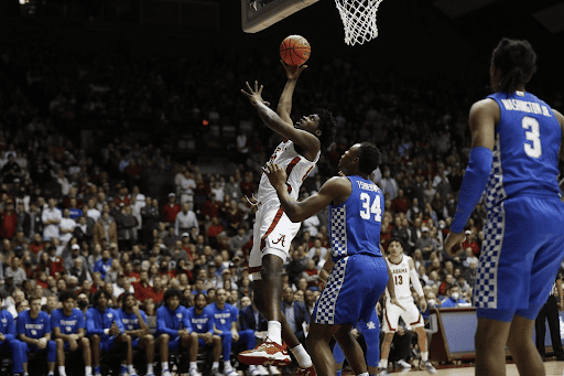 Alabama forward Charles Bediako (10) goes up for a layup on Kentucky’s Oscar Tshiebwe in the Crimson Tide’s 66-55 loss to the Wildcats on Feb. 5, 2022. 