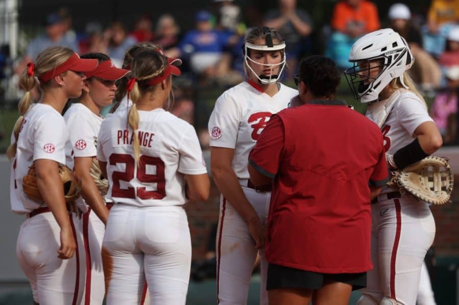 Alabama pitcher Montana Fouts (14) engages in a mound visit with pitching coach Stephanie VanBrakle Prothro in the Crimson Tide's 3-0 loss to the Missouri Tigers in the SEC Tournament Quarterfinals at Katie Seashole Pressly Stadium in Gainesville, Florida.